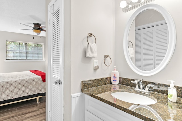 bathroom featuring hardwood / wood-style floors, vanity, and ceiling fan