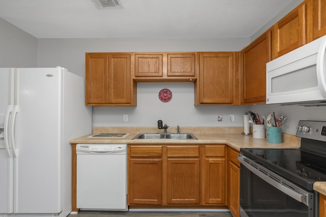 kitchen with white appliances and sink