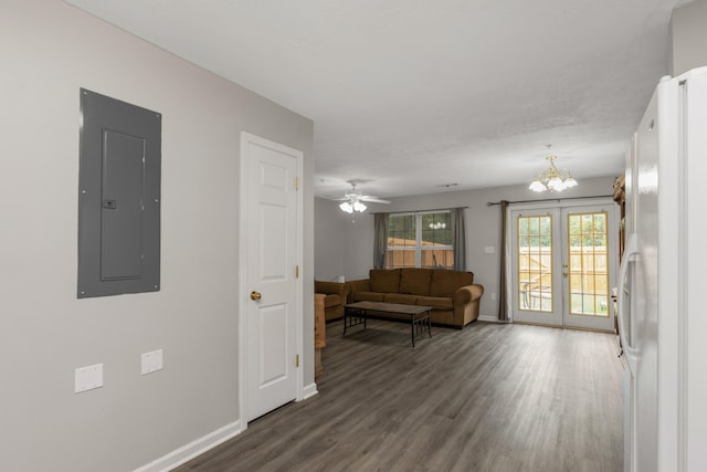 living room with french doors, electric panel, ceiling fan with notable chandelier, and dark hardwood / wood-style floors