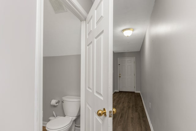 hall with dark hardwood / wood-style flooring