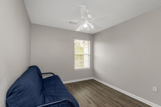 sitting room featuring dark hardwood / wood-style flooring and ceiling fan