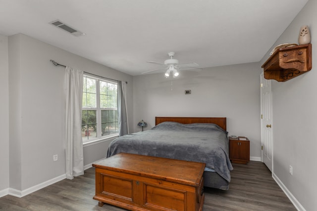 bedroom featuring ceiling fan and dark hardwood / wood-style flooring