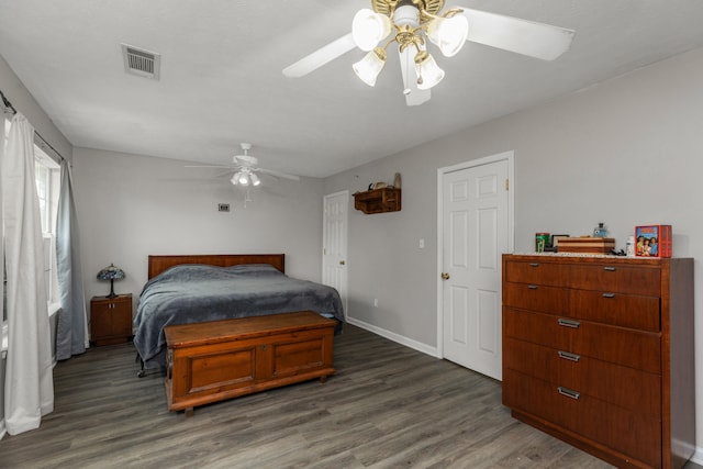 bedroom with ceiling fan and dark hardwood / wood-style floors