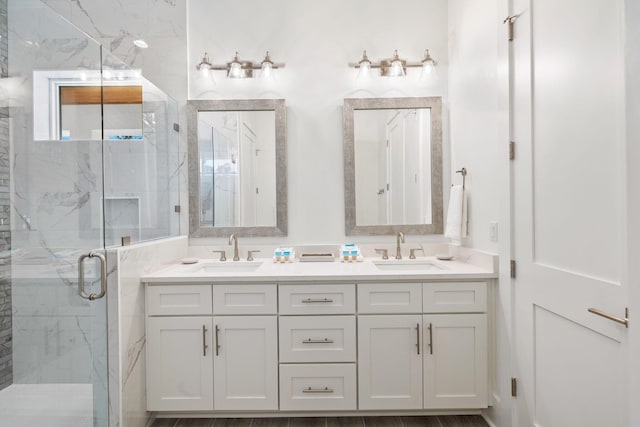 bathroom with vanity, an enclosed shower, and hardwood / wood-style floors