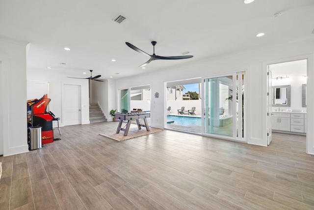 interior space featuring light hardwood / wood-style floors and ceiling fan