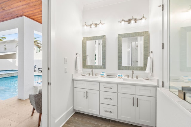 bathroom featuring vanity and wood ceiling