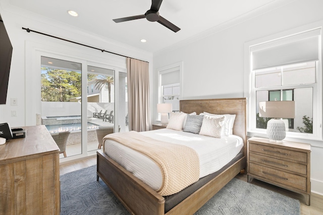 bedroom featuring access to exterior, light wood-type flooring, ornamental molding, and ceiling fan