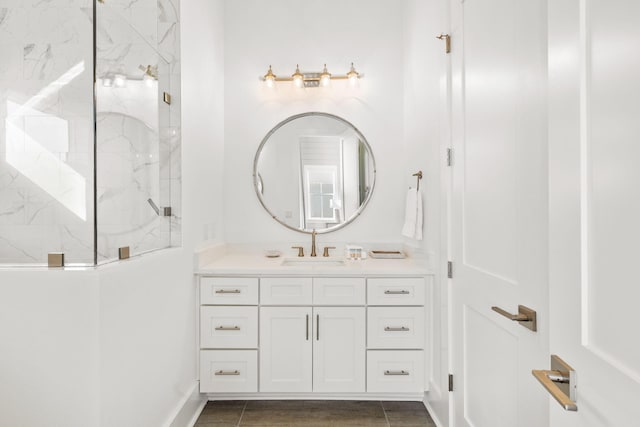 bathroom featuring vanity and tiled shower