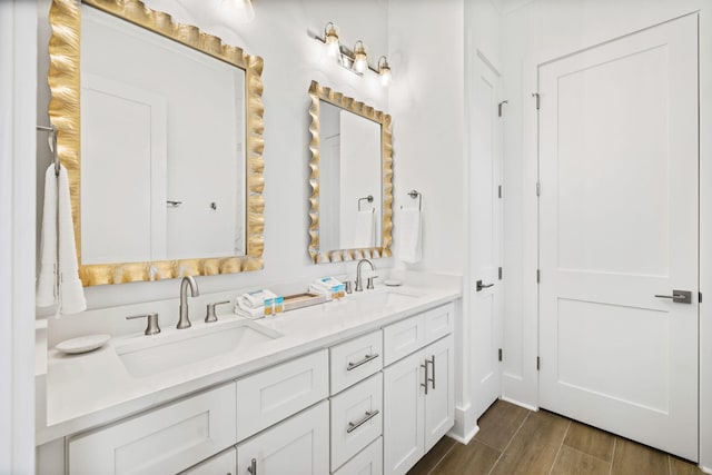 bathroom with vanity and hardwood / wood-style flooring