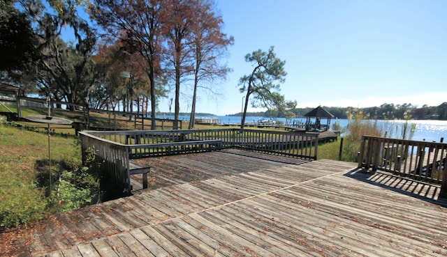 wooden deck featuring a water view