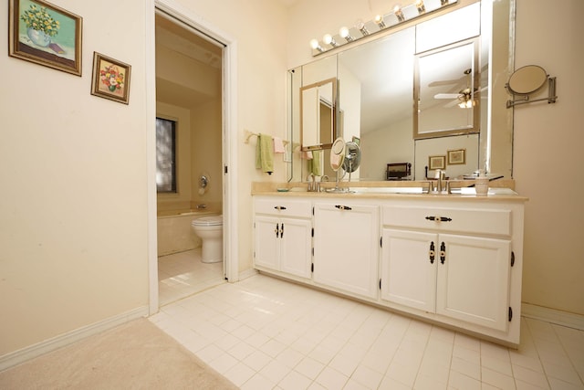 bathroom featuring vanity, ceiling fan, tile patterned floors, and toilet