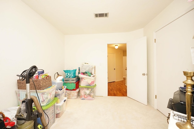 game room featuring light colored carpet