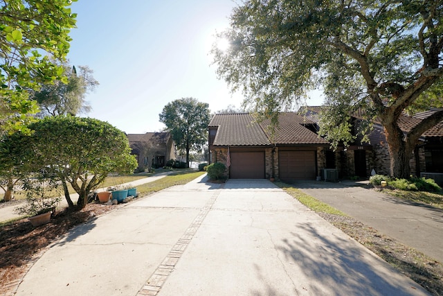 exterior space featuring a garage and central AC unit