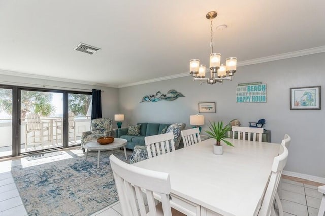 tiled dining space featuring crown molding and a notable chandelier