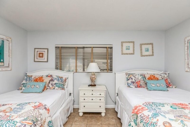 bedroom featuring light tile patterned floors