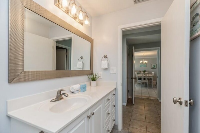 bathroom with tile patterned floors and vanity