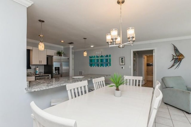 dining area with a notable chandelier, light tile patterned flooring, and crown molding