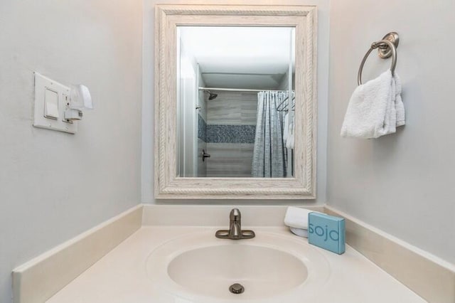 bathroom featuring sink and walk in shower