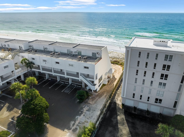 bird's eye view featuring a view of the beach and a water view