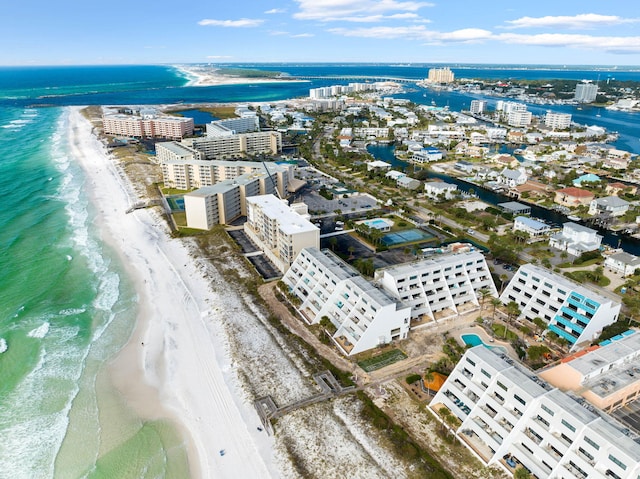 drone / aerial view featuring a beach view and a water view