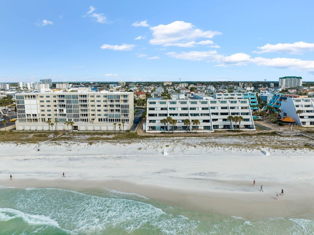 aerial view featuring a view of the beach and a water view