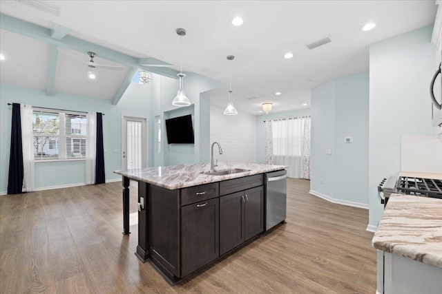 kitchen with vaulted ceiling with beams, dark brown cabinets, sink, light hardwood / wood-style floors, and dishwasher