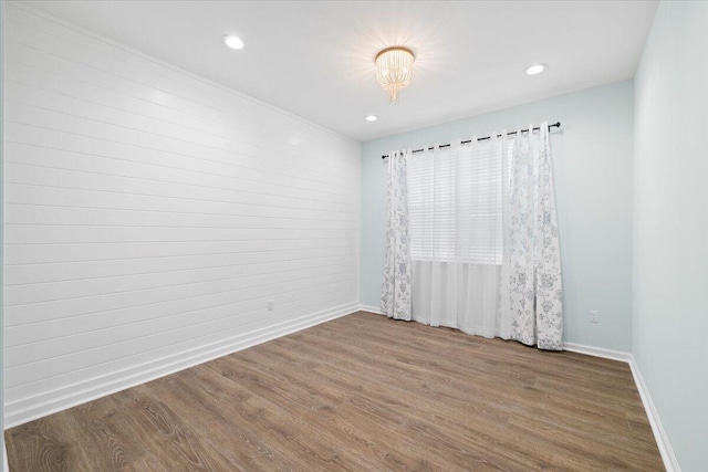 empty room featuring wood-type flooring