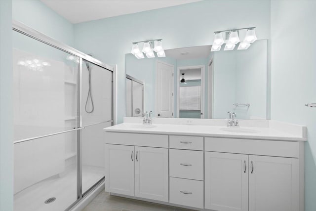 bathroom with vanity and a shower with shower door