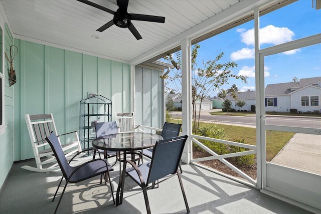 sunroom / solarium with ceiling fan