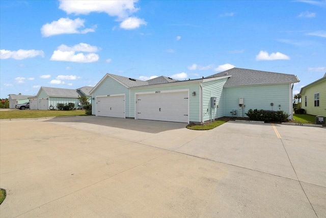 view of side of property with a garage