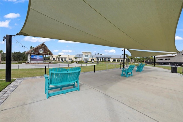 view of home's community featuring a patio and a yard