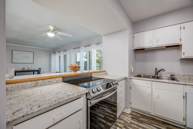 kitchen featuring white cabinets, sink, ceiling fan, stainless steel electric range oven, and dark hardwood / wood-style flooring