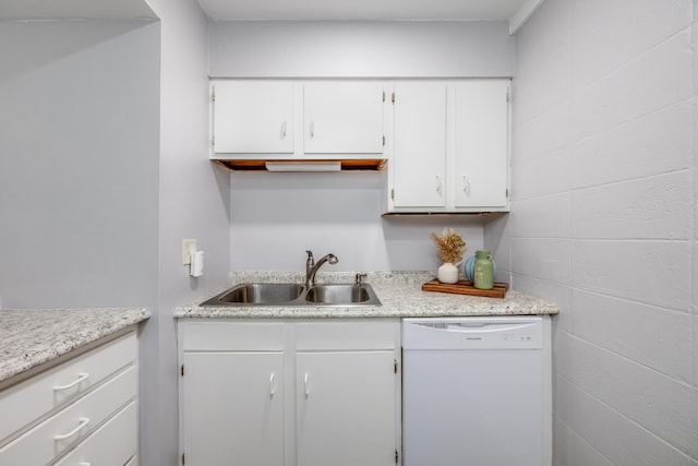 kitchen featuring white dishwasher, white cabinetry, and sink