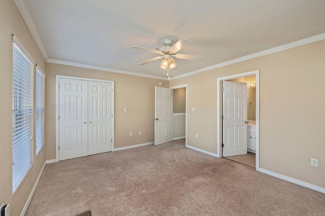 unfurnished bedroom with ceiling fan, ornamental molding, light carpet, and ensuite bath