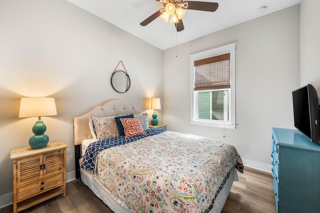 bedroom featuring dark hardwood / wood-style floors and ceiling fan