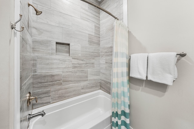 bathroom with shower / tub combo with curtain