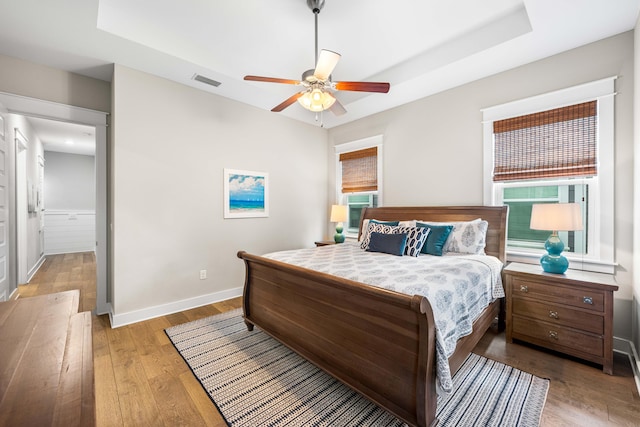 bedroom featuring light hardwood / wood-style floors and ceiling fan