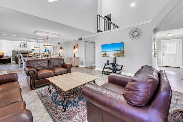 900 Gulf Shore Dr Unit 03, Destin, FL 32541 - living area with light tile patterned floors, baseboards, and crown molding
