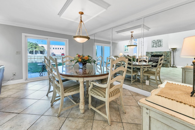 900 Gulf Shore Dr Unit 03, Destin, FL 32541 - dining space with crown molding, light tile patterned flooring, and baseboards