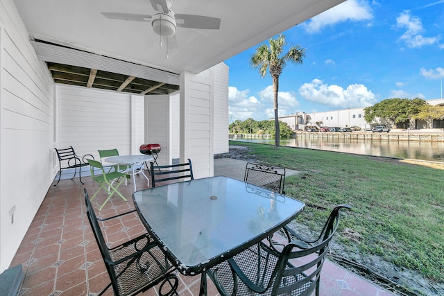 900 Gulf Shore Dr Unit 03, Destin, FL 32541 - view of patio / terrace featuring outdoor dining space, a water view, and ceiling fan
