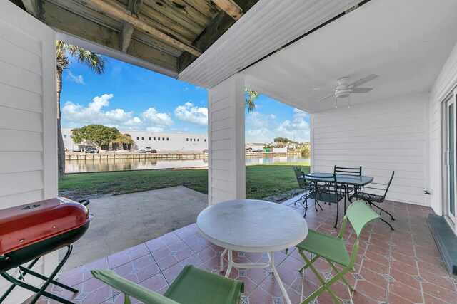 900 Gulf Shore Dr Unit 03, Destin, FL 32541 - view of patio / terrace with a water view, ceiling fan, outdoor dining space, and a grill