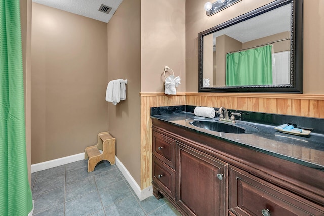 900 Gulf Shore Dr Unit 03, Destin, FL 32541 - full bathroom with vanity, tile patterned flooring, a shower with shower curtain, and baseboards