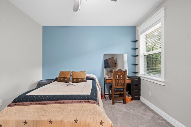 carpeted bedroom featuring ceiling fan