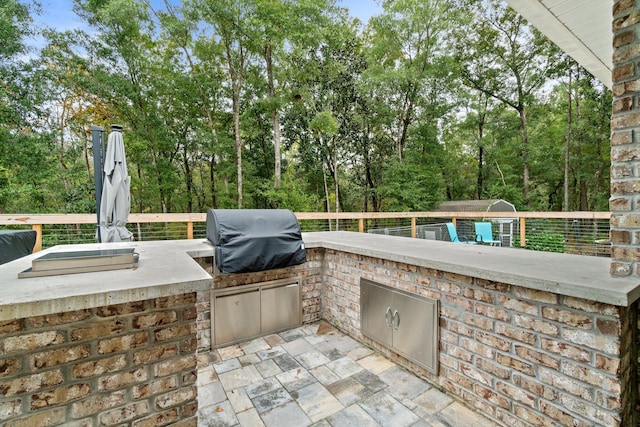 view of patio / terrace featuring an outdoor kitchen and grilling area