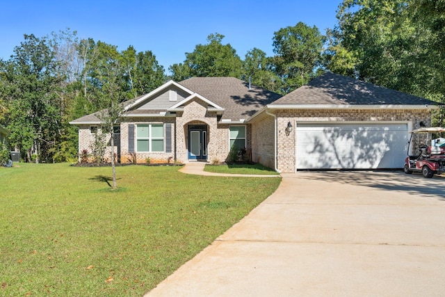 view of front of property with a garage and a front lawn