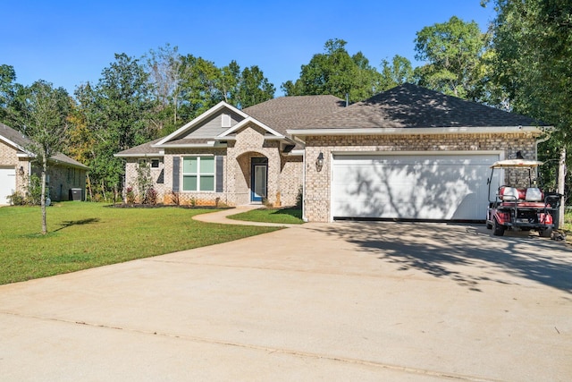 view of front of house with a front yard and a garage