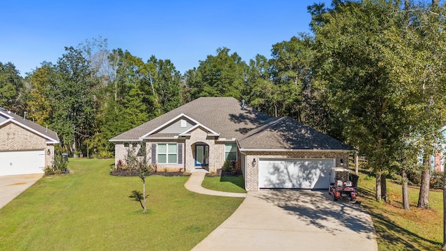 view of front of house featuring a front yard and a garage