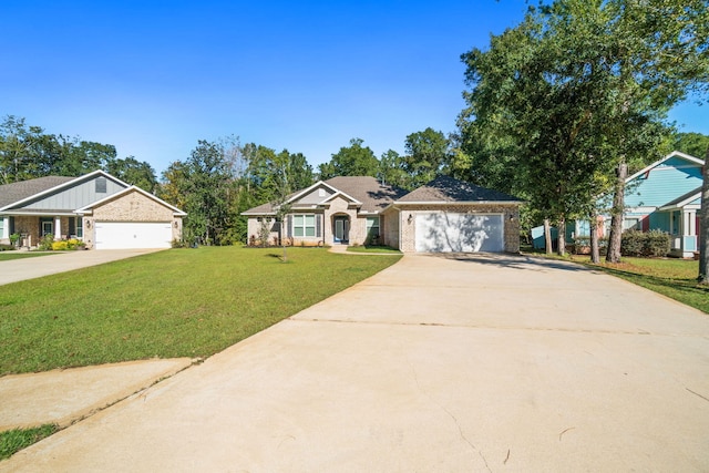 ranch-style home featuring a front lawn and a garage