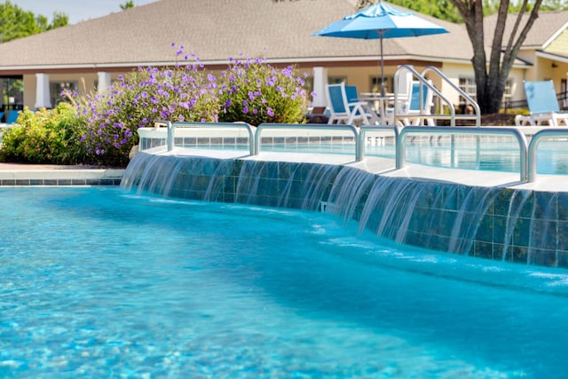 view of pool featuring pool water feature