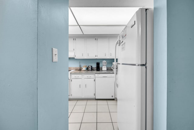 909 Santa Rosa Blvd Unit 561, Fort Walton Beach, FL 32548 - kitchen featuring white cabinets, white appliances, and light tile patterned floors